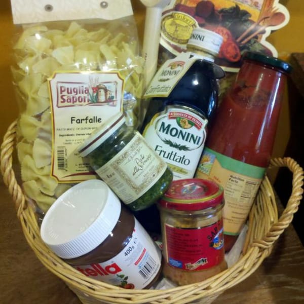 A gift basket from Tino's Delicatessen filled with Italian pasta, sauces, olive oil, and Nutella.